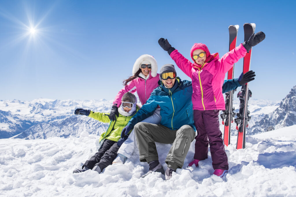 Laughing,Family,In,Winter,Vacation,With,Ski,Sport,On,Snowy