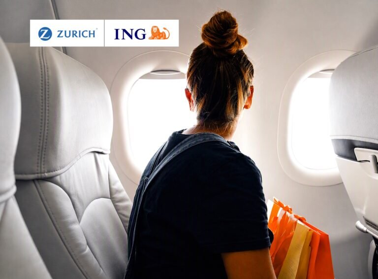 Back view of a woman with a topknot sitting by an airplane window, holding orange shopping bags; Zurich and ING logos at top-left.